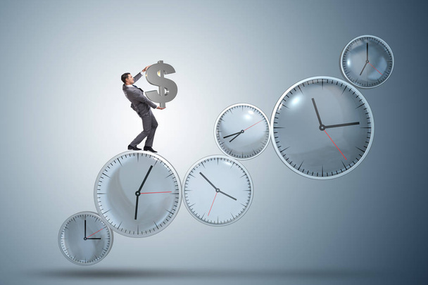 Tijd is geld concept met zakenman dollar te houden - Foto, afbeelding