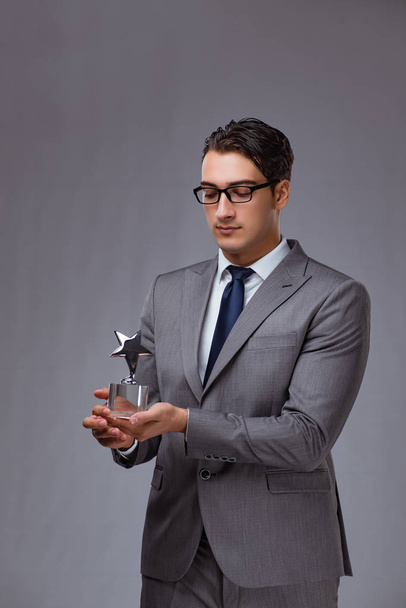 Businessman holding star award in business concept - Fotó, kép