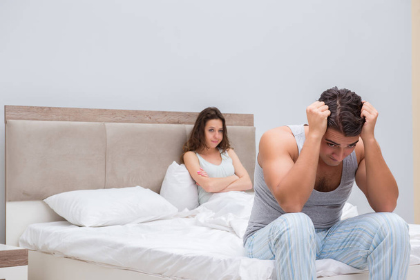 Family conflict with wife and husband in bed - Foto, imagen