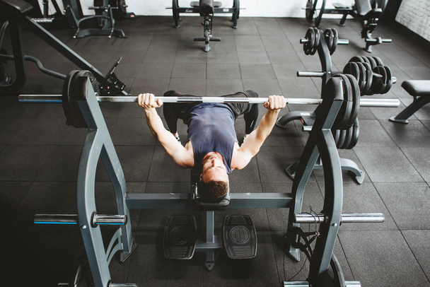 Man exercising at gym - Photo, Image