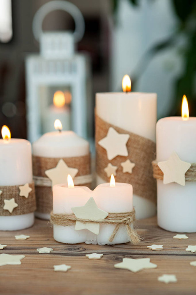 Burning Christmas candles - 写真・画像