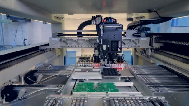 Automated machine manufacturing PCBs in action. - Footage, Video