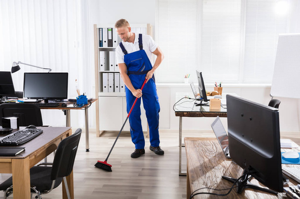Male Janitor Cleaning Floor  - Fotó, kép