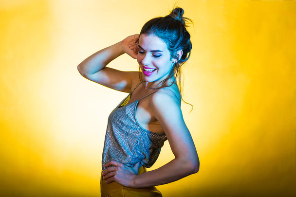 Beautiful woman posing in disco lights - Фото, зображення
