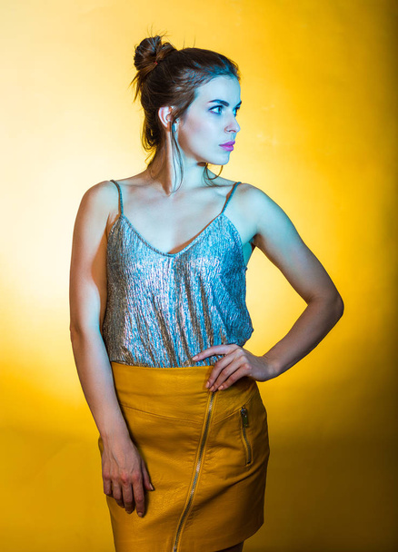 Beautiful woman posing in disco lights - Fotó, kép