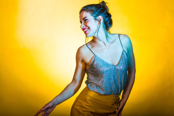 Beautiful woman posing in disco lights - Foto, Imagen
