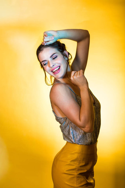 Beautiful woman posing in disco lights - Fotografie, Obrázek