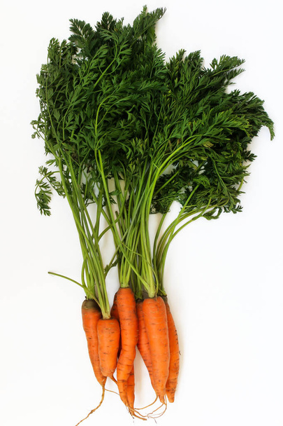 Fresh raw carrots isolated on a white background. - Foto, imagen