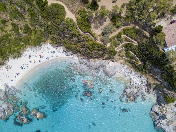 Paradise of the sub, beach with promontory overlooking the sea. Zambrone, Calabria, Italy. Diving relaxation and summer vacations. Italian coasts, beaches and rocks. Aerial view - Photo, Image