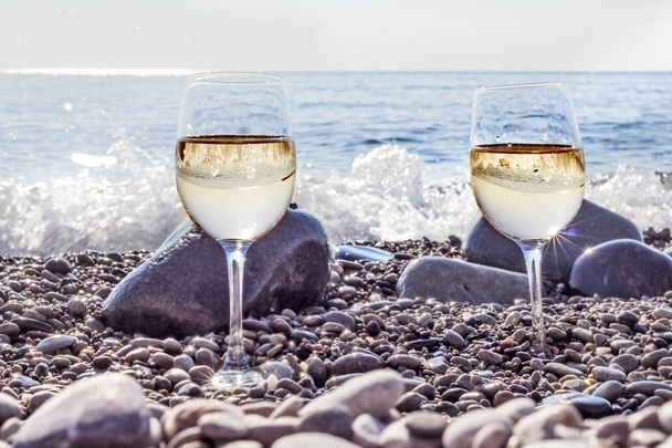 Two glasses of wine on beach  - Valokuva, kuva