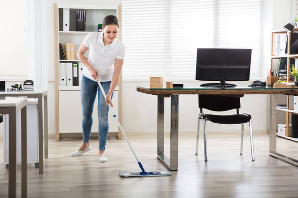 Young Woman Cleaning Floor - Фото, зображення