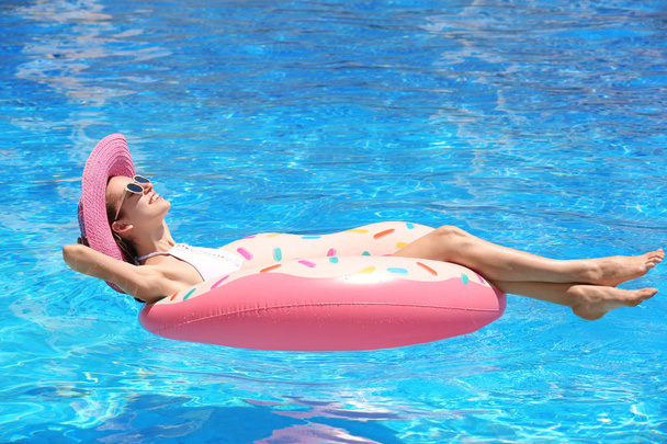 young woman with inflatable donut  - Photo, image