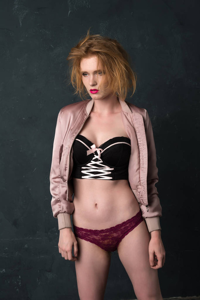 Redhead in pink and black - Foto, Imagen