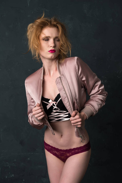 Redhead in pink and black - Photo, Image