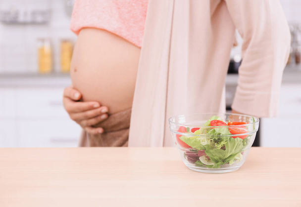  pregnant woman with bowl of salad - Photo, Image