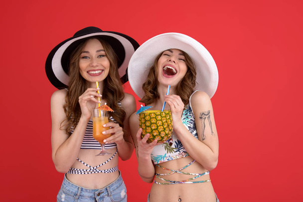 Happy two women drinking cocktails. - Fotografie, Obrázek