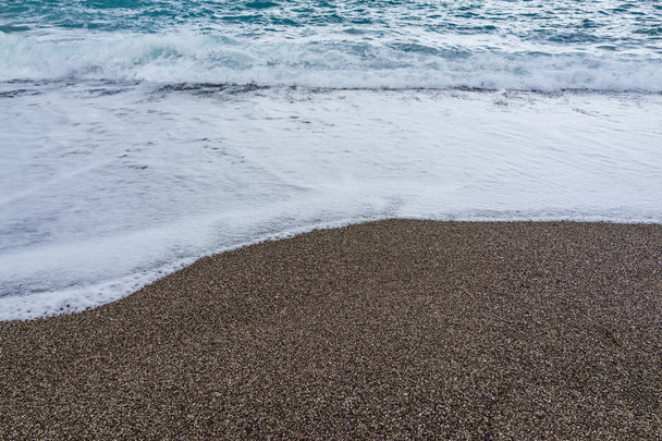 Soft waves foam in blue ocean italy coast, summer evening as bac - Zdjęcie, obraz