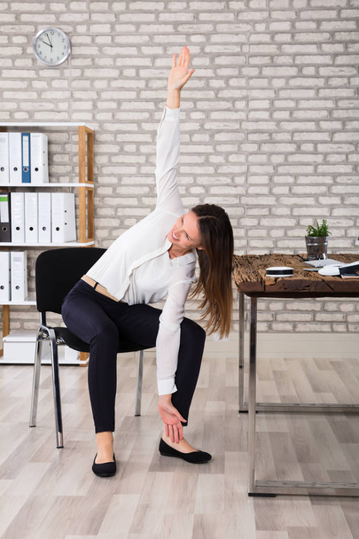Female Manager Stretching  - Φωτογραφία, εικόνα