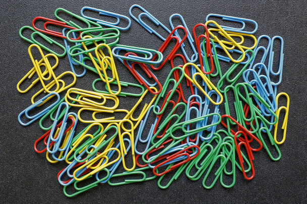 colorful office paper clips on black background - Photo, Image