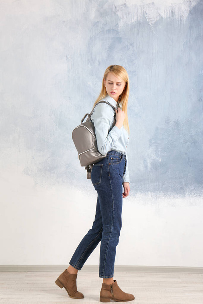 Young woman with leather backpack - Fotoğraf, Görsel