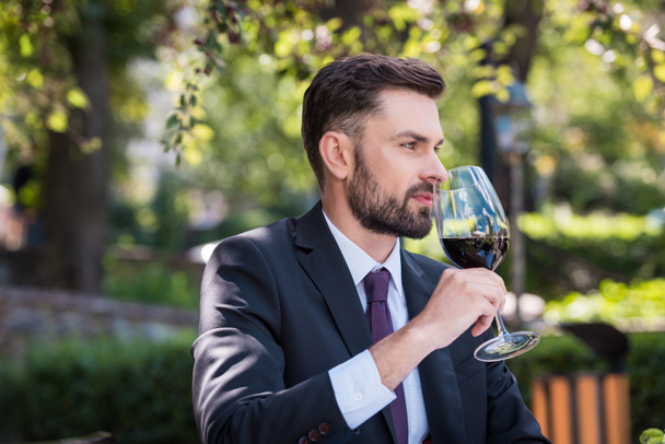 caucasian man with wine in restaurant - Valokuva, kuva