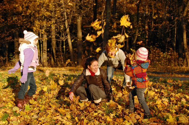 Family in autumn park - Foto, Imagen