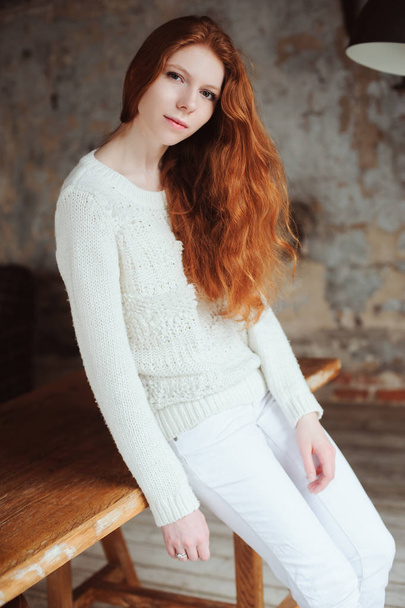 close up indoor portrait of adorable thoughtful young redhead woman with freckles and long hair - Foto, Bild