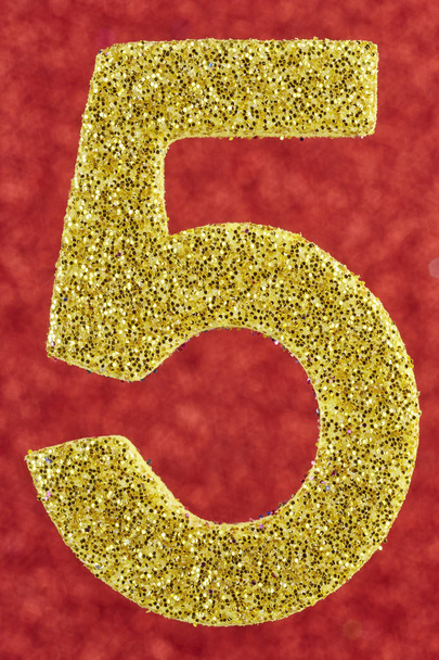 Number golden silver color over a red background. Anniversary.  - Photo, Image