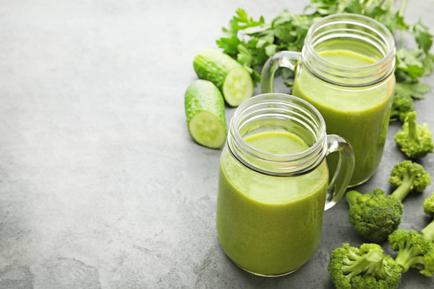 Bottles of green vegetable juice - Фото, изображение