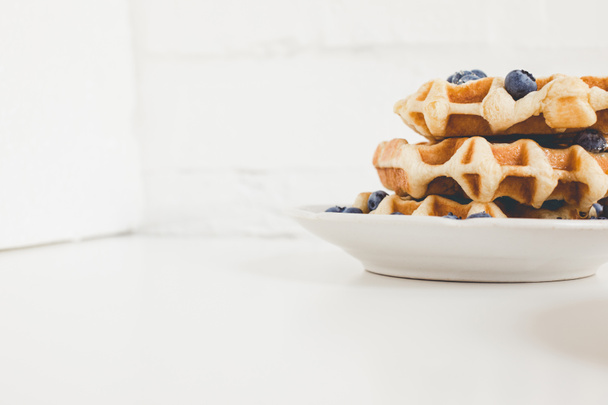 tasty waffles with blueberries - Фото, зображення