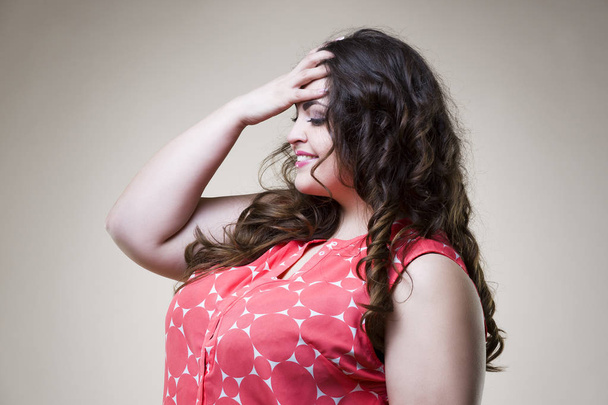 Happy plus size fashion model in casual clothes, fat woman on beige background, overweight female body - Valokuva, kuva