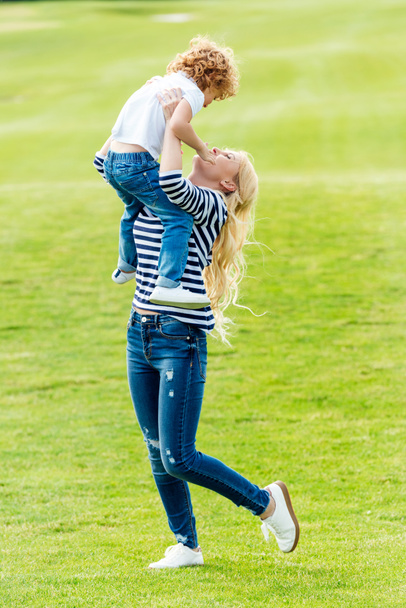 happy mother with son at park - Photo, Image