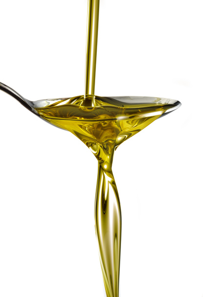 оливкова олія потік на ложці
 - Фото, зображення