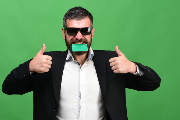 Guy with happy face and sunglasses isolated on green background - Fotografie, Obrázek