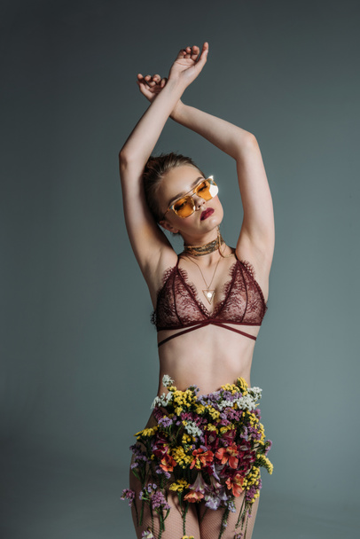 model posing in floral skirt - 写真・画像