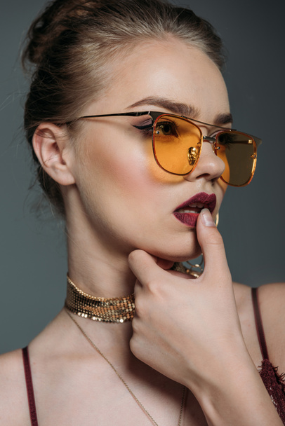 seductive model in orange sunglasses - Zdjęcie, obraz