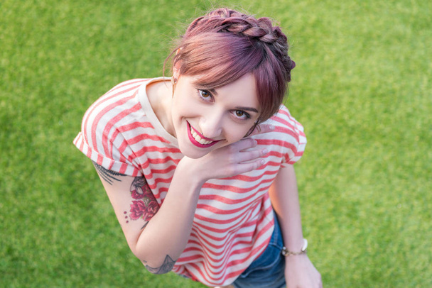 smiling girl standing on lawn - Zdjęcie, obraz