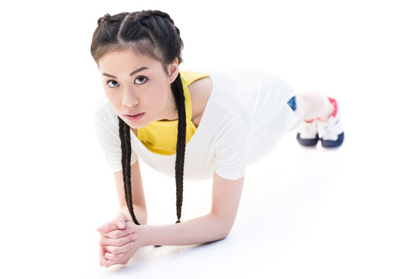 asiático chica haciendo tablón ejercicio
 - Foto, Imagen