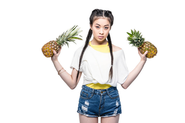asian woman with pineapples - 写真・画像