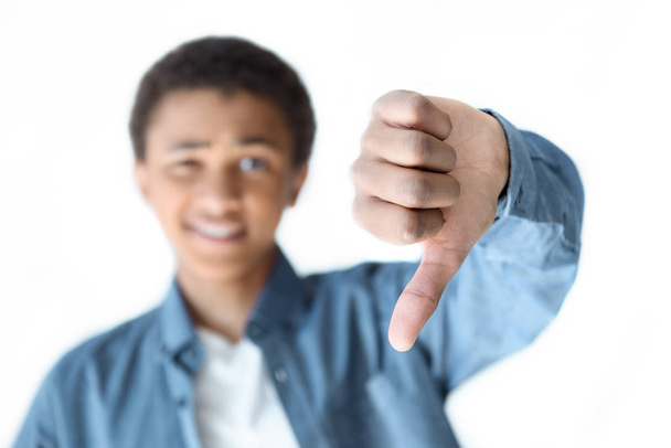 african american teenager showing thumb down - Фото, изображение
