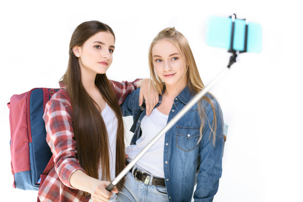 teenage girls taking selfie together - Фото, изображение