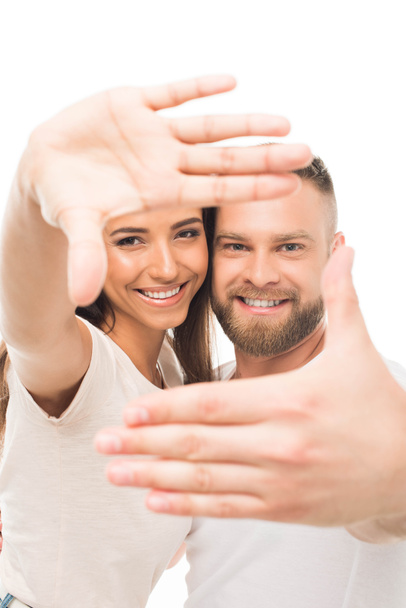 atractiva pareja con marco de manos
 - Foto, imagen