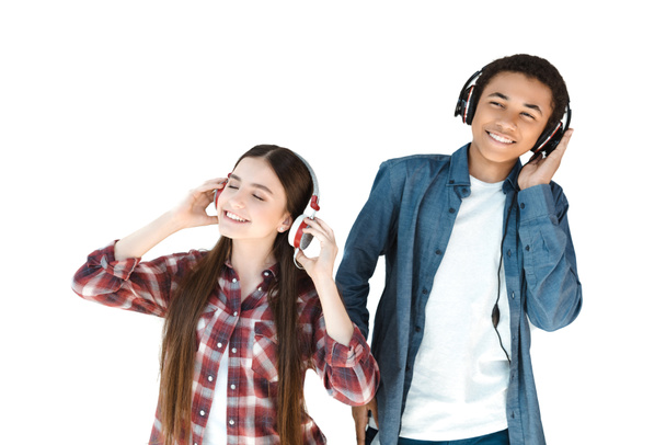 multiethnic teenagers listening music in headphones - Foto, immagini