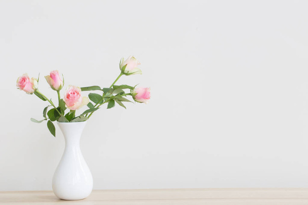 pink roses in vase on white background - Fotoğraf, Görsel