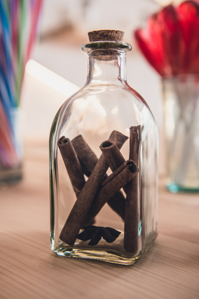 aromatic cinnamon sticks in bottle - Photo, Image