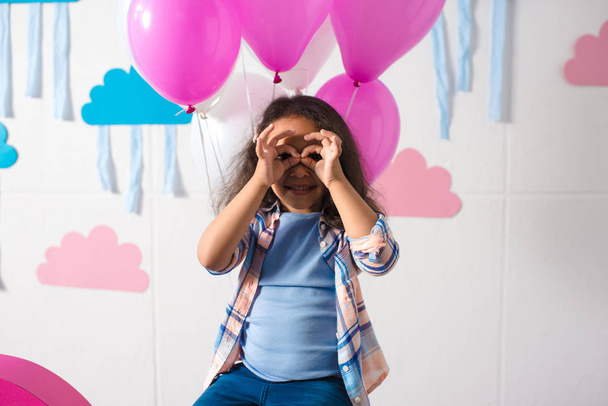 girl with balloons at birthday party - Fotó, kép