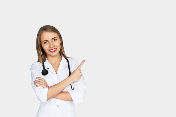 Female doctor holding arms folded pointing - Photo, Image