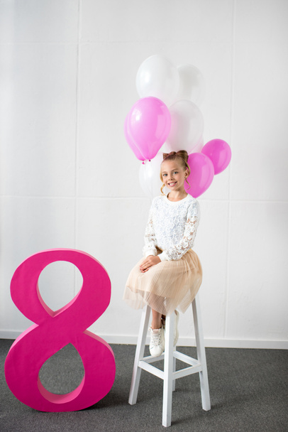 girl with balloons at birthday party - Fotoğraf, Görsel