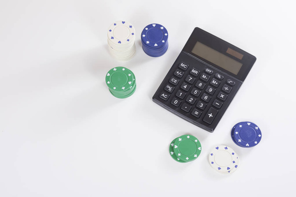 Стек гральних фішок з калькулятором
 - Фото, зображення