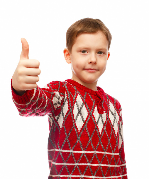 vidám szőke fiú egy vörös pulóverben, ujját feltartotta elkülönítése - Fotó, kép